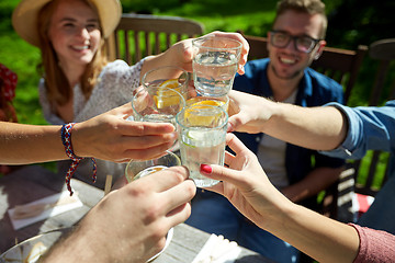 Image showing happy friends with drinks at summer garden party