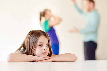 Image showing beautiful sad girl and parents arguing at home