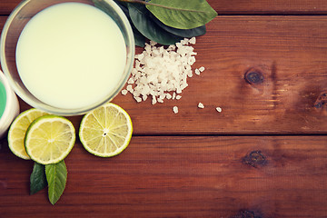 Image showing close up of citrus body lotion in bowl on wood