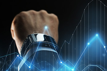 Image showing close up of businessman hand with smartwatch