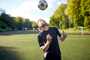 Image showing soccer player playing with ball on field