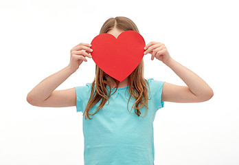 Image showing little girl hiding her face behind red paper heart