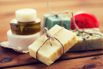Image showing close up of handmade soap bars on wood
