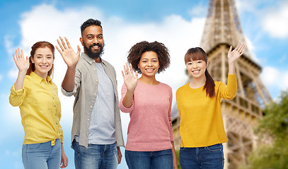 Image showing international group of happy people waving hands