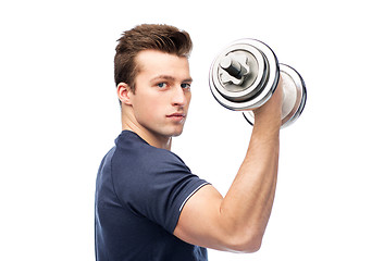 Image showing sportive young man with dumbbell