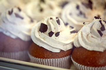 Image showing close up of cupcakes or muffins with frosting