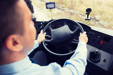 Image showing close up of driver driving passenger bus