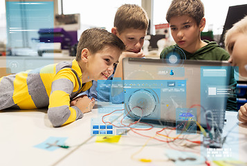 Image showing kids, laptop and invention kit at robotics school