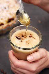 Image showing Coffee late sweetened with honey