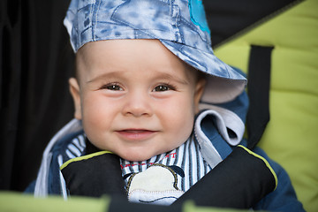 Image showing baby boy sitting in the pram