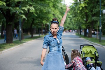 Image showing mother with her daughters in the park