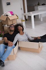 Image showing African American couple  playing with packing material