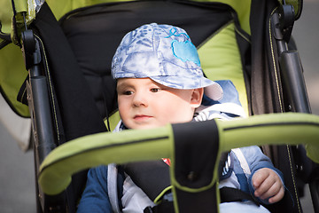 Image showing baby boy sitting in the pram