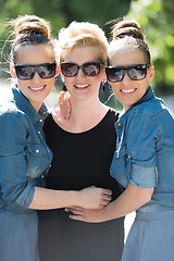 Image showing portrait of three young beautiful woman with sunglasses