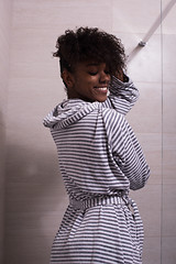 Image showing beautiful black woman wearing  bathrobe