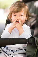 Image showing baby girl sitting in the pram