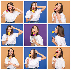 Image showing young woman with the colorful lollipop at studio