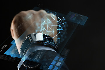 Image showing close up of businessman hand with smartwatch