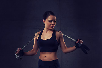 Image showing young sporty woman with jumping rope