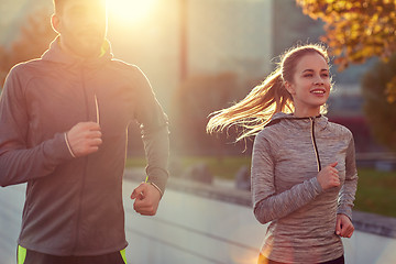 Image showing happy couple running outdoors