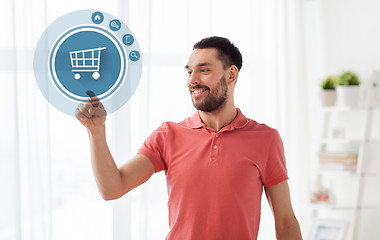 Image showing man with shopping cart icon projection at home