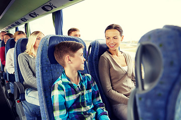 Image showing happy family riding in travel bus