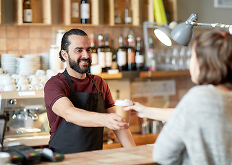 Image showing man or waiter serving customer in coffee shop