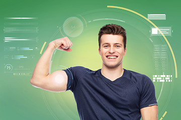 Image showing sportive man showing bicep power