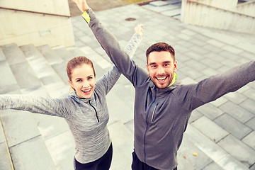 Image showing happy smiling couple outdoors on city street