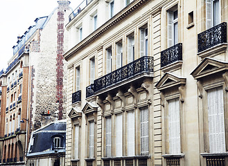 Image showing houses on french streets of Paris. citylife concept, black balcony lace