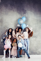 Image showing Lifestyle and people concept: young pretty diversity nations woman with different age children celebrating on birth day party together happy smiling, making selfie. African-american, asian and caucasi