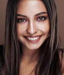 Image showing cute happy young indian real woman in studio close up smiling, fashion mulatto