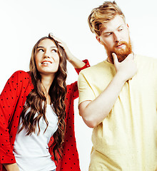 Image showing young pretty teenage couple, hipster guy with his girlfriend happy smiling and hugging isolated on white background, lifestyle people concept 