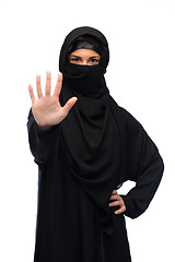 Image showing muslim woman in hijab showing stop sign