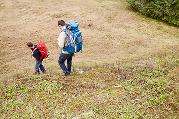 Image showing friends with backpacks hiking