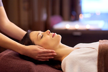 Image showing woman having face and head massage at spa