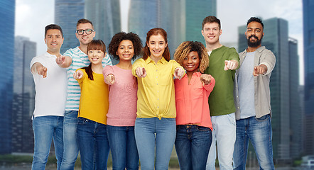 Image showing international group of people pointing on you