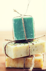 Image showing close up of handmade soap bars on wood