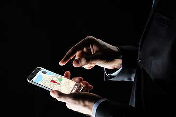 Image showing close up of businessman with gps map on smartphone