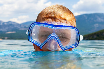 Image showing Boy with scuba mask in a lake 