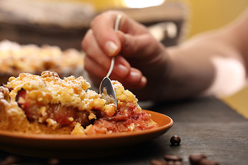 Image showing Homemade cake with fruit. Tart on flaky pastry with plums and powdered sugar