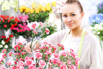 Image showing A bouquet of red roses course of floristic Laying flowers Cut flowers, carnations