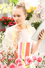 Image showing Flowers on the phone. Florist online. Flowers delivered to your home.