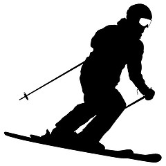 Image showing Mountain skier speeding down slope. sport silhouette