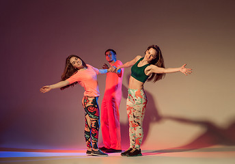 Image showing Group of man, woman and teens dancing hip hop choreography