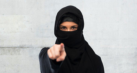 Image showing muslim woman in hijab pointing finger to you