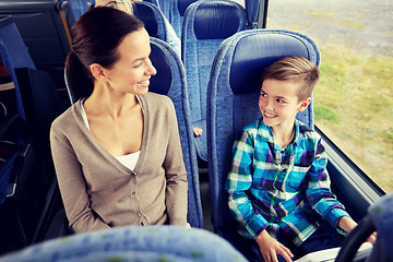 Image showing happy family riding in travel bus