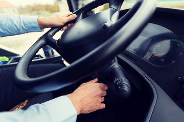 Image showing close up of driver starting bus