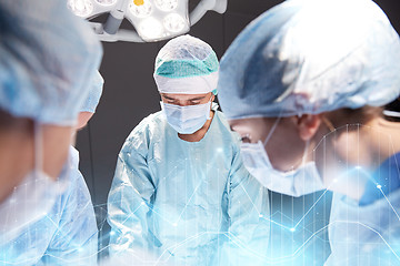 Image showing group of surgeons in operating room at hospital