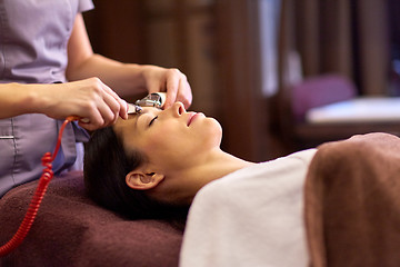 Image showing woman having hydradermie facial treatment in spa